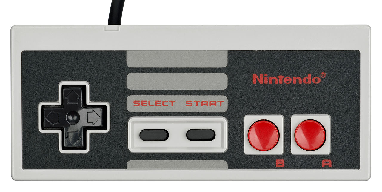il game PAD della console NES fonte Wikimedia: (https://commons.wikimedia.org/wiki/User:Evan-Amos)